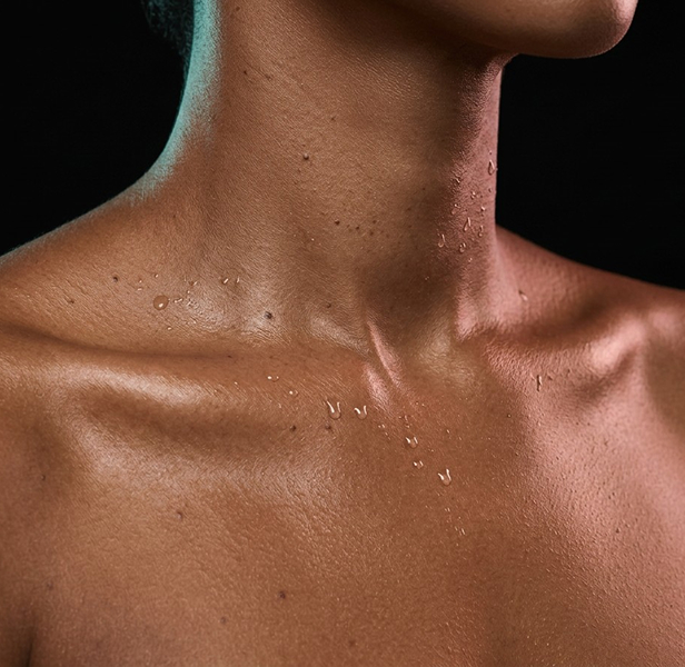 Sun-kissed skin with water droplets